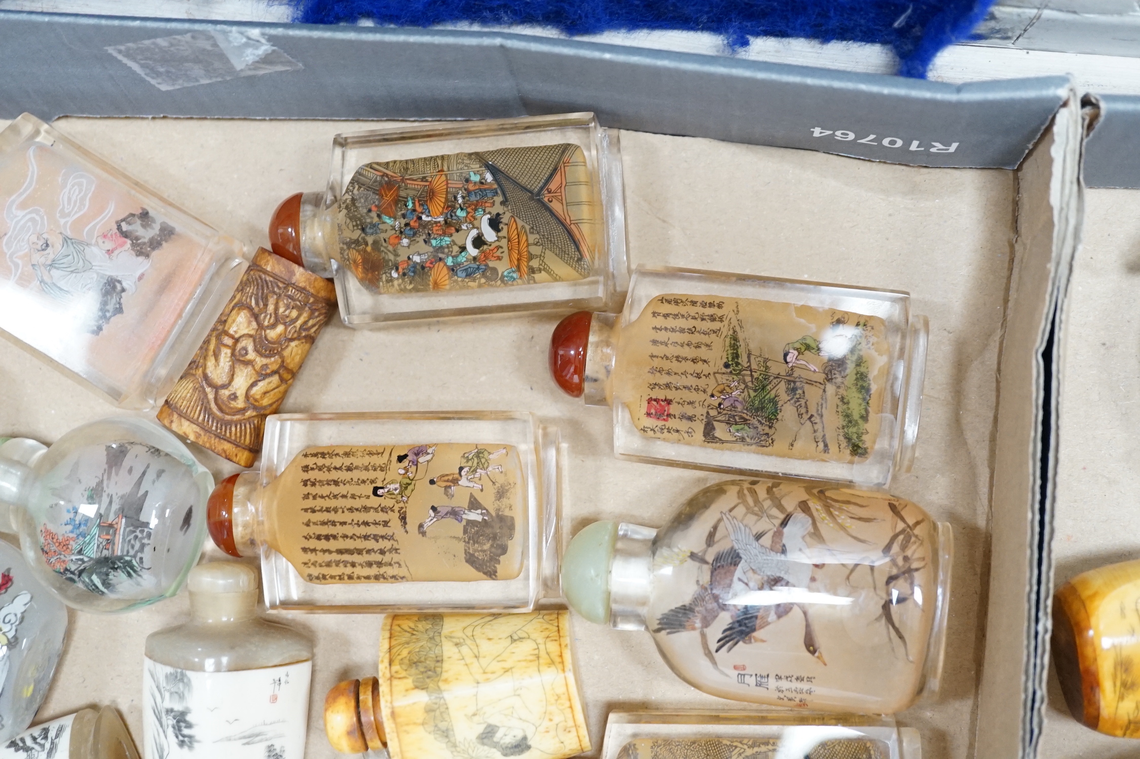 A collection of Chinese snuff bottles, mostly reverse painted (2 trays)